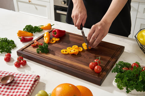 Deep juice groove catches liquids, reducing countertop mess during fruit prep