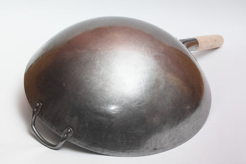 Craft Wok hand-hammered surface detail by Guangzhou artisans.