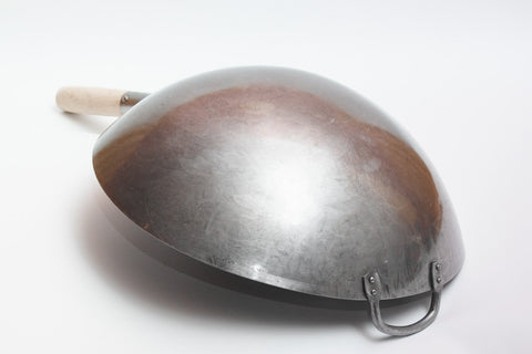 Craft Wok wooden handle with steel helper handle shown for comfortable stir-frying.