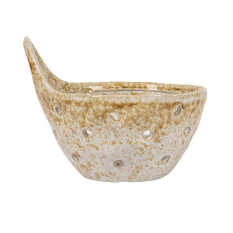 Creative Co-Op close-up of beige glaze texture on stoneware colander