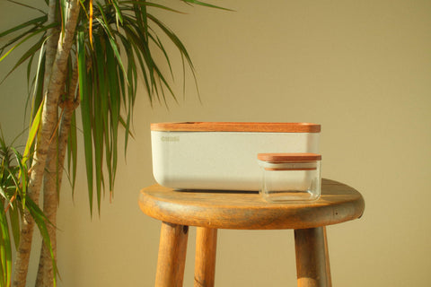 Compact white box design fits on shelves and counters.