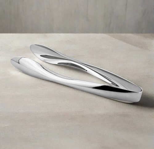 Cuisinox 6 inch tongs on a dining setting for effortless portion control