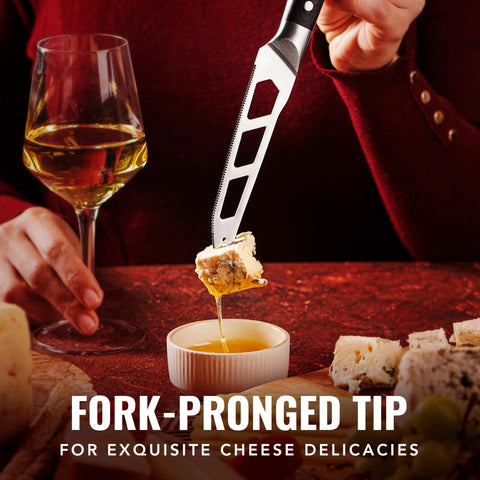 Cutluxe cheese knife serrated edge provides precise cheese slices.