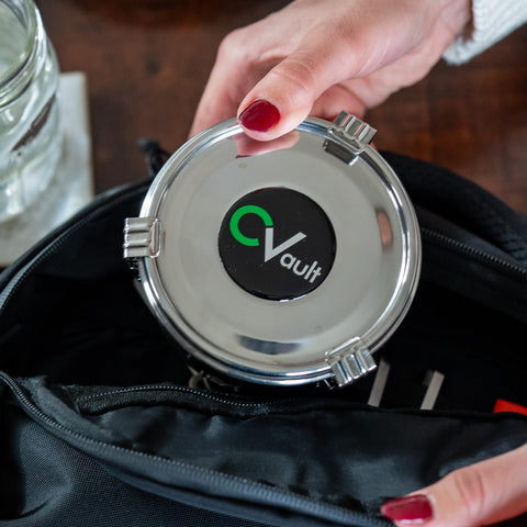 CVAULT storage container lid securely closes for travel-friendly portability.