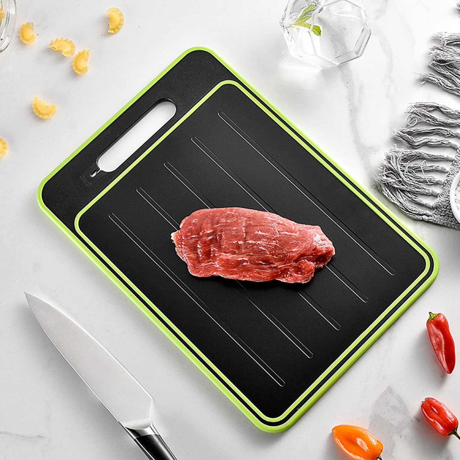 Cyrank thawing plate cutting board helps thaw meat while you prep vegetables.