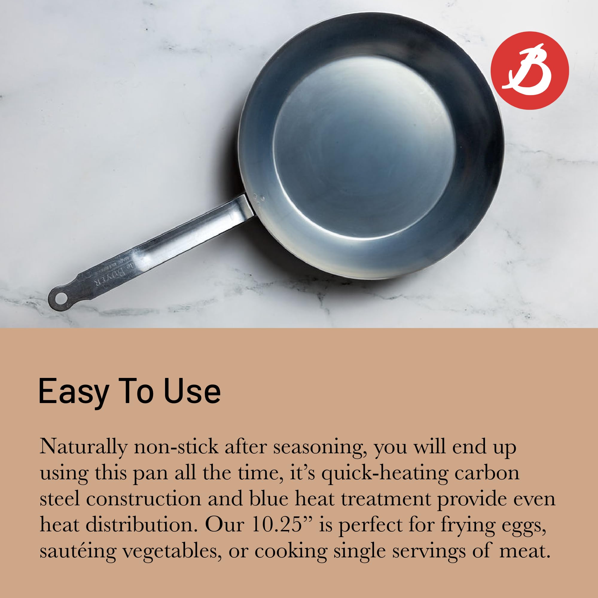 Sizzling steak in blue carbon steel pan by De Buyer