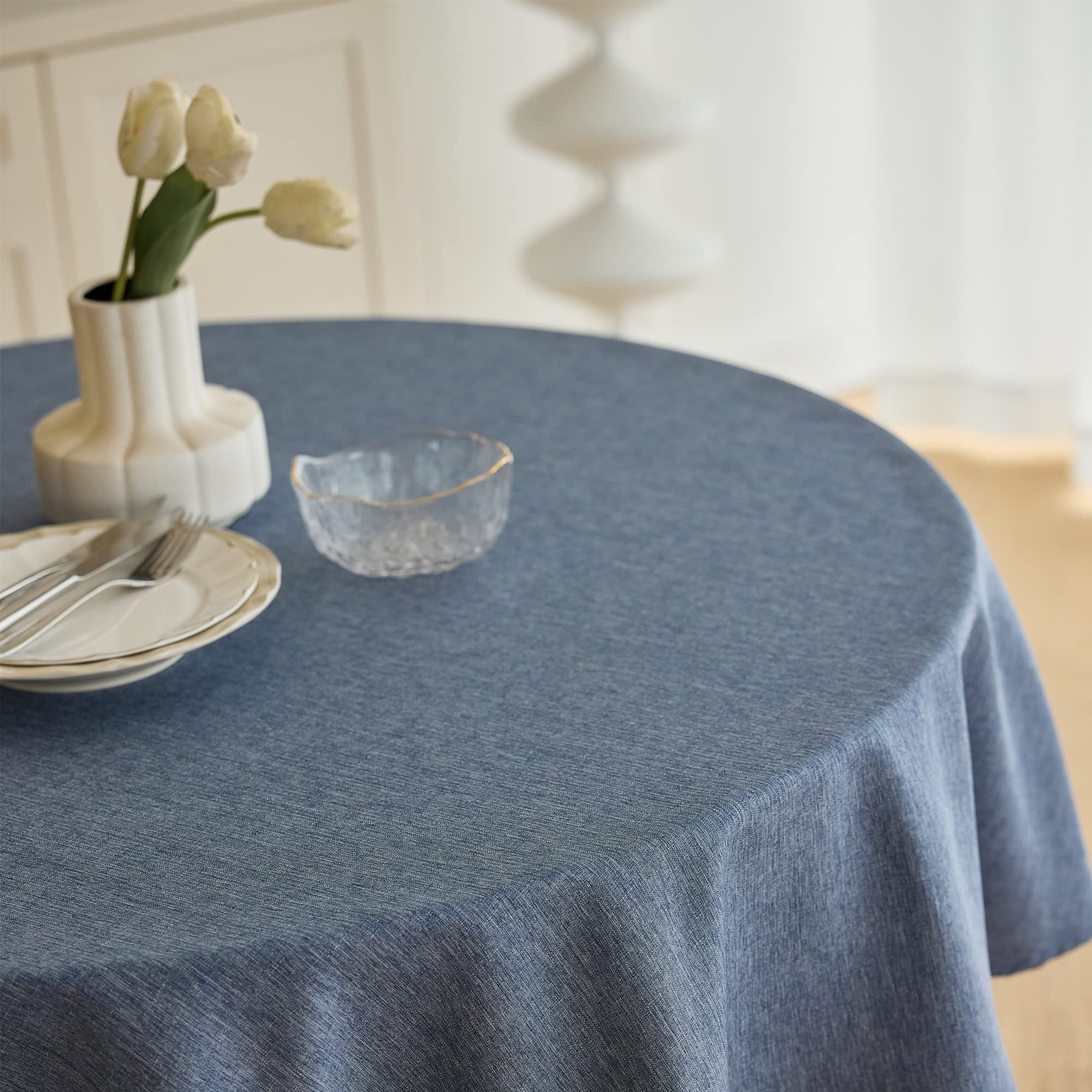 Decorelia waterproof round tablecloth shown in a dining setup with spill resistance