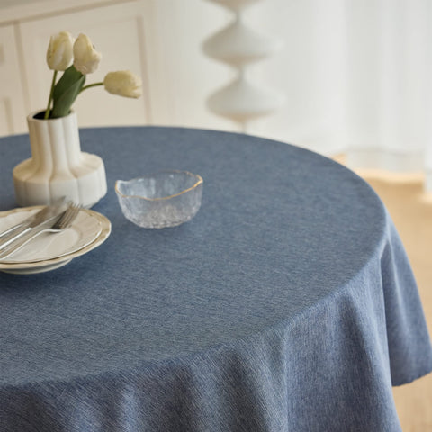 Decorelia waterproof round tablecloth shown in a dining setup with spill resistance