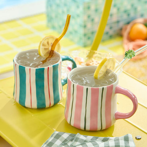 DELIGHTS GALORE 12oz pink-green mugs keep beverages warm and satisfying.