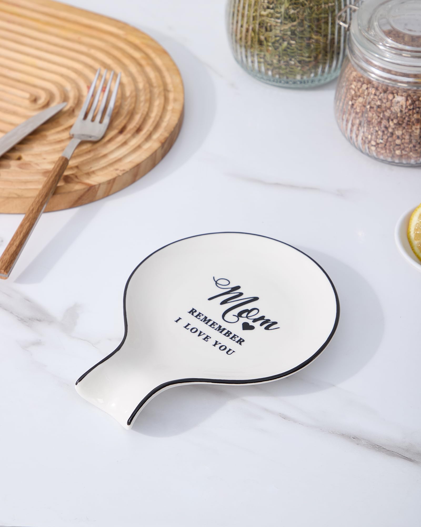 Delpnana spoon holder on stove top preventing drips while cooking.