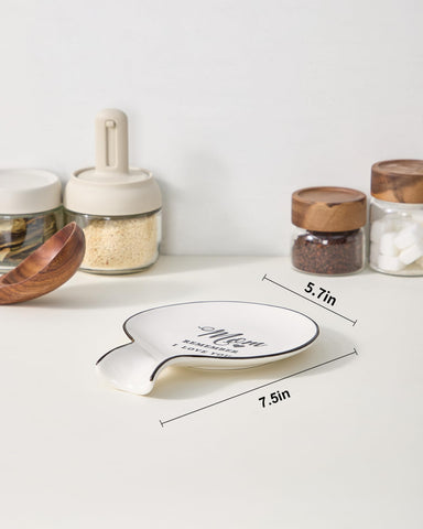 Delpnana white ceramic spoon rest, dishwasher safe and sturdy.