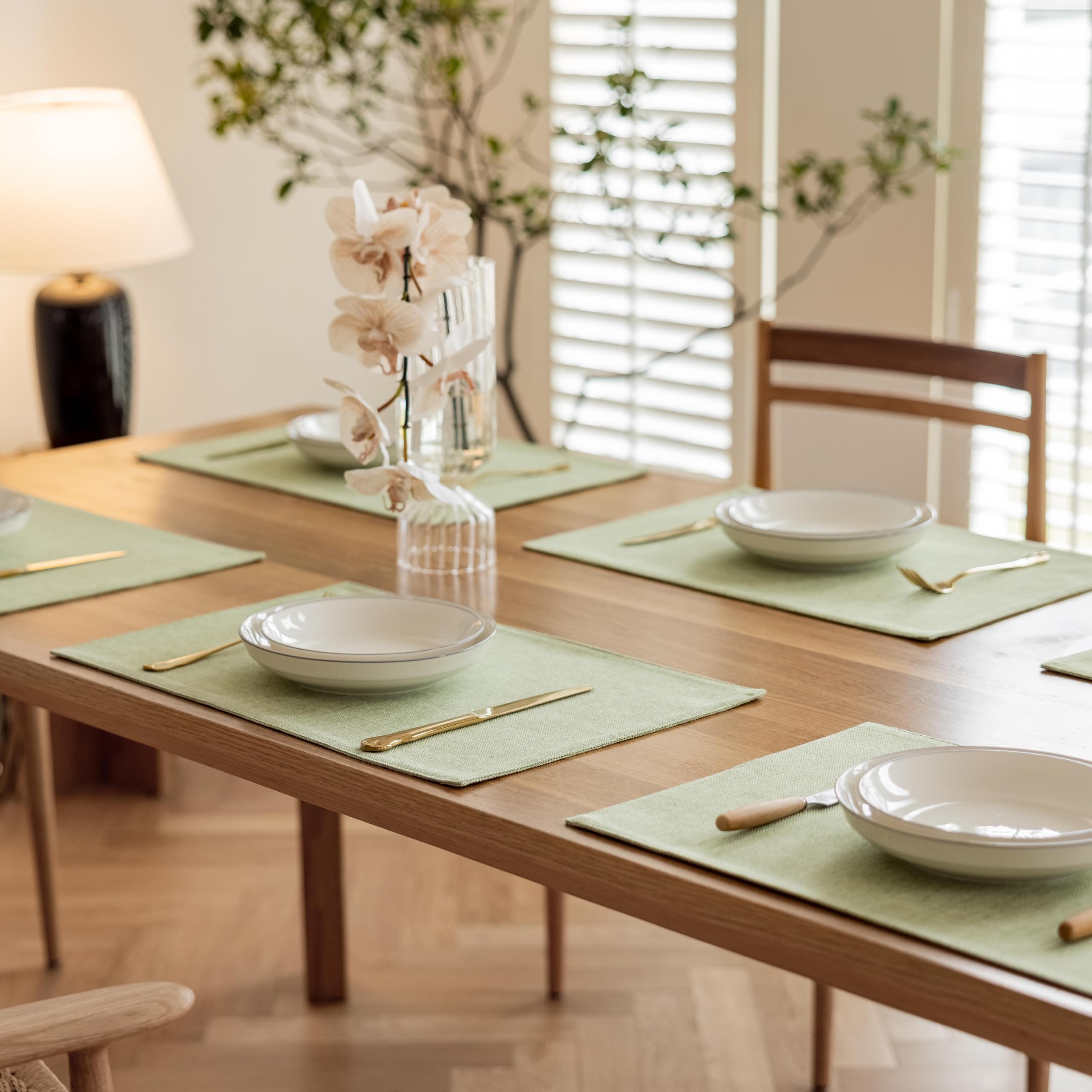 Demetex Green placemats available in multiple colors for versatile table styling.