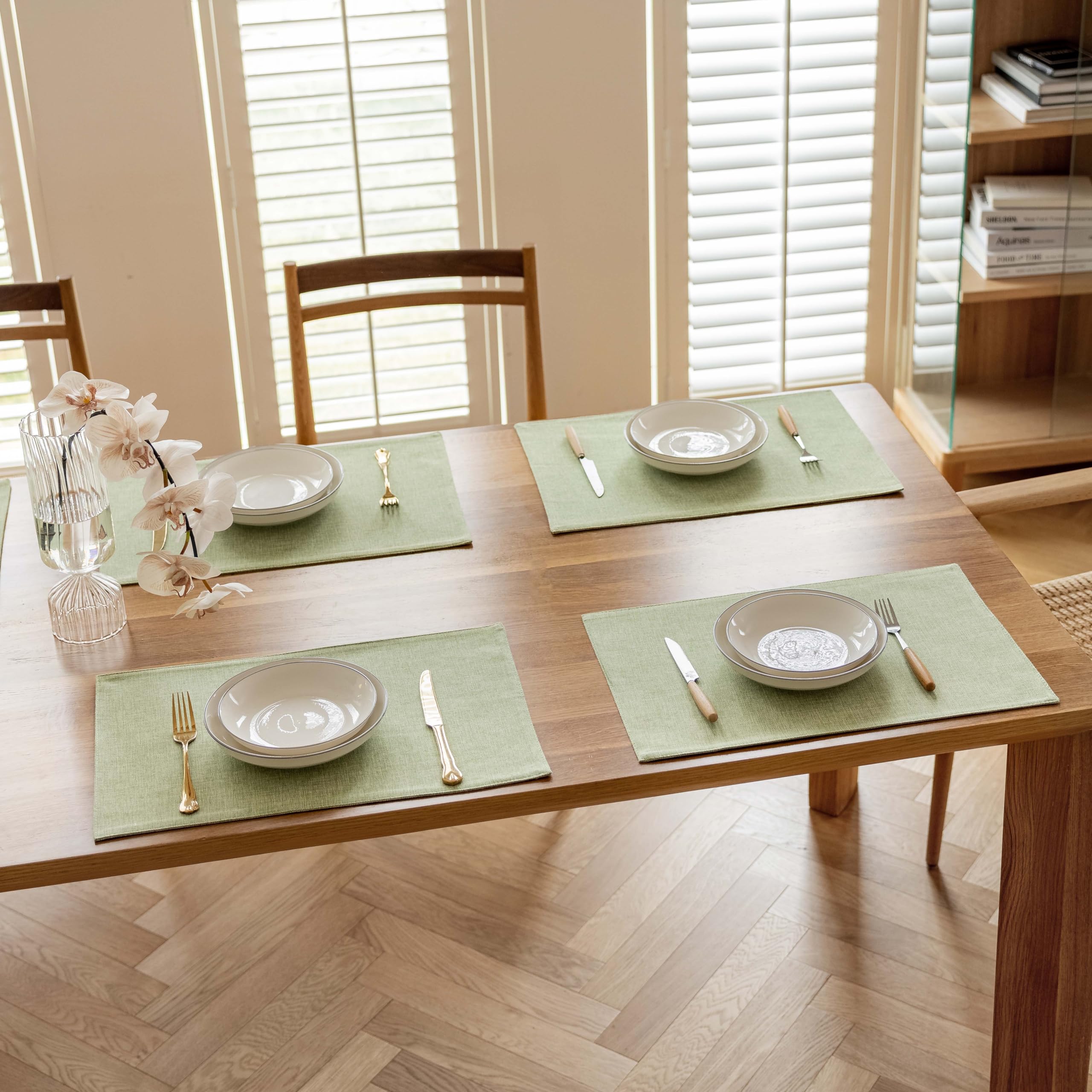 Demetex Green placemats decorative design complements dark wood or white tabletops.