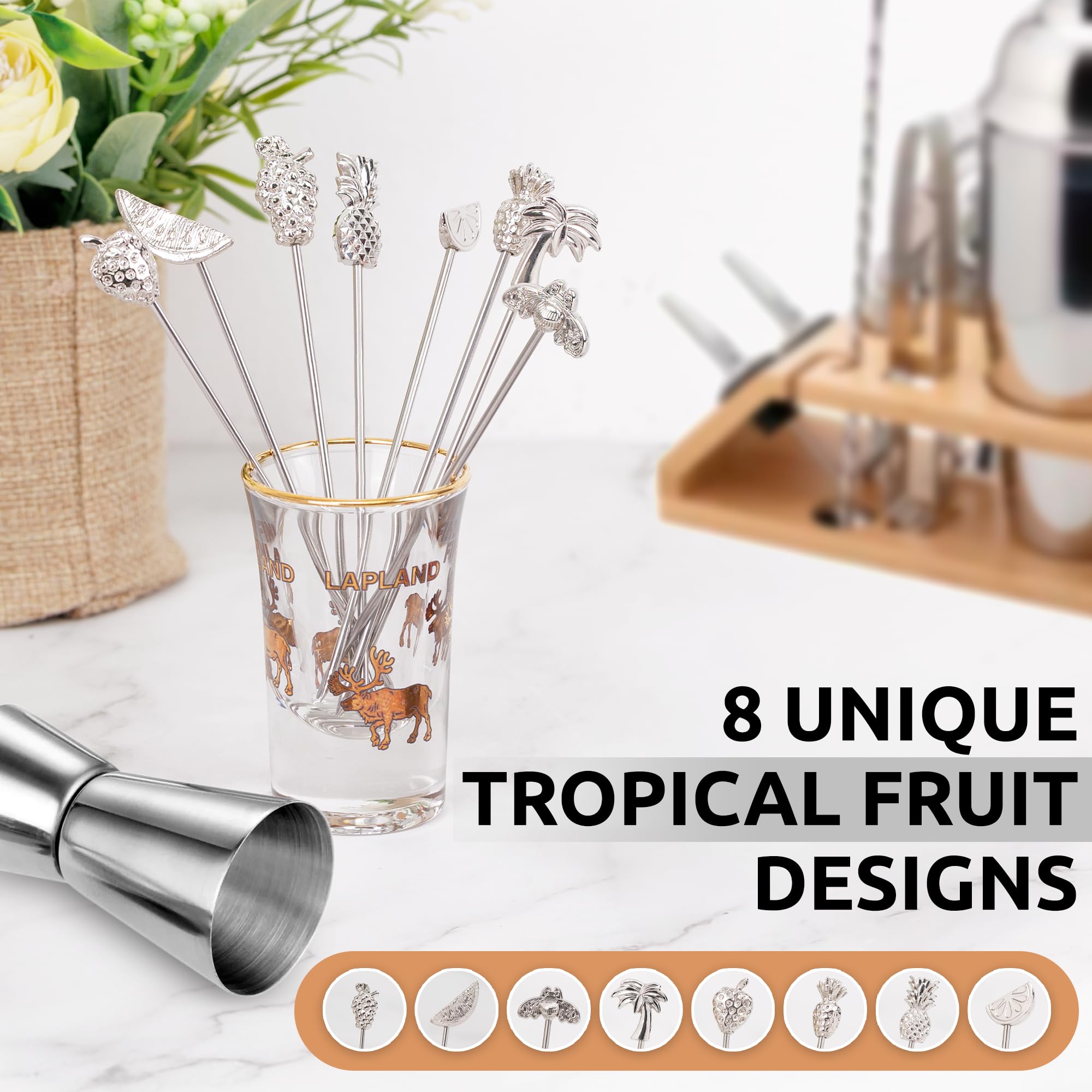 Demigo fruit-shaped picks with watermelon topper secure garnishes in tall glasses.
