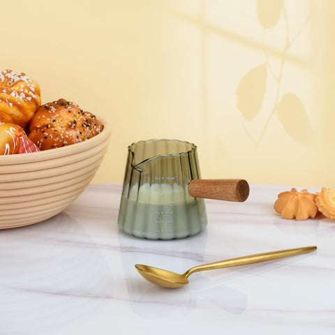 Denovin pour-spout pitcher ideal for milk or creamer.