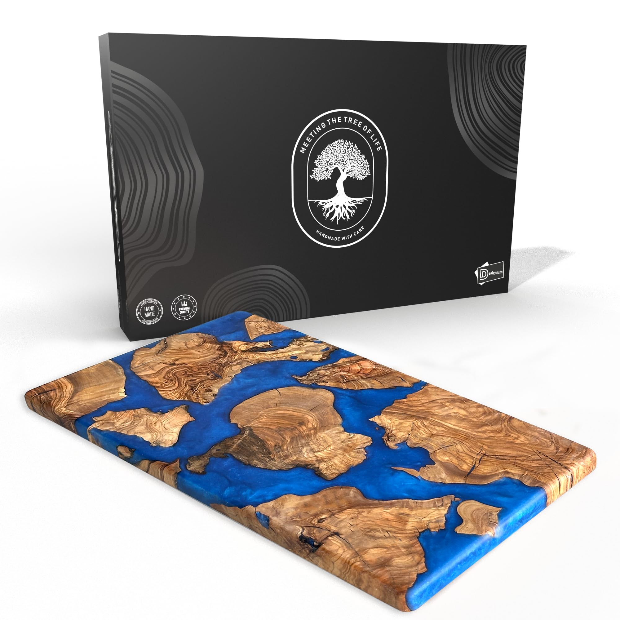 Designium olive wood resin cutting board close-up showing dense grain for longevity.