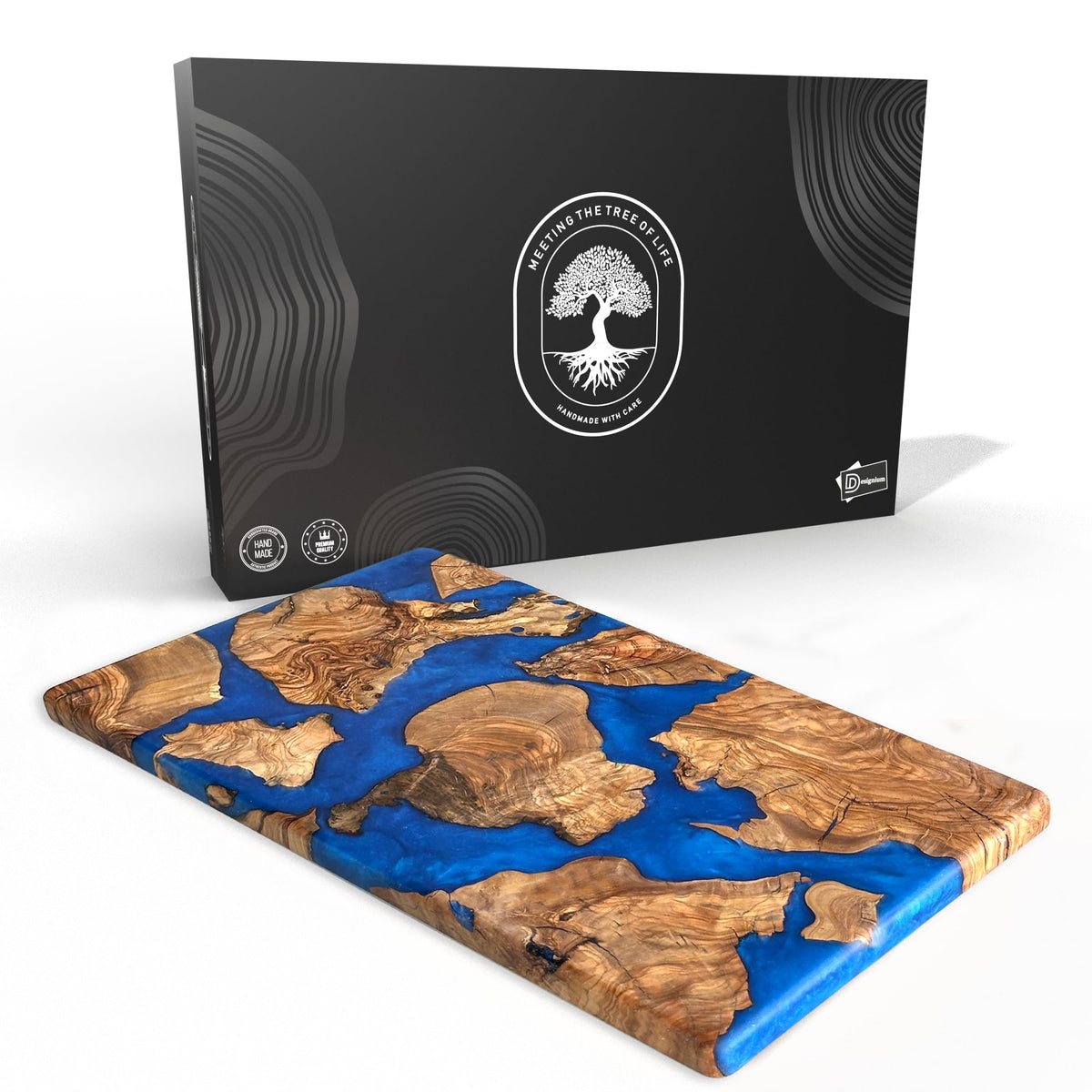 Designium olive wood resin cutting board close-up showing dense grain for longevity.