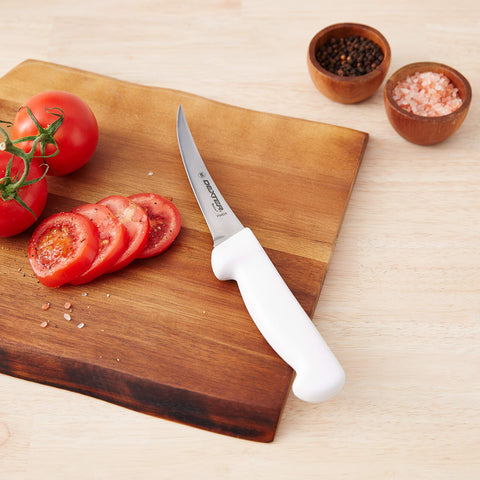 Dexter Russell P94824 boning knife ergonomic handle shown for secure grip during prep.