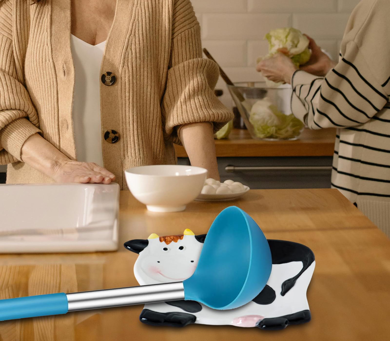 dgudgu Cow Spoon Rest utensil holder on the counter for tidy prep.
