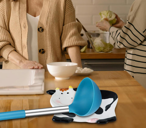 dgudgu Cow Spoon Rest utensil holder on the counter for tidy prep.