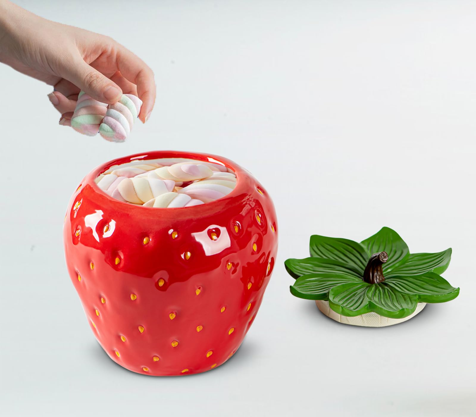 dgudgu strawberry candy jar on shelf blends with decor.