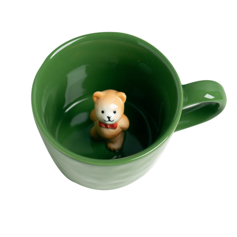 DIHOclub Bow Tie Bear inside mug reveals cute surprise for coffee moments.