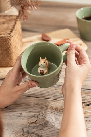 DIHOclub Squirrel mug bottom reveal enhances sipping experience.