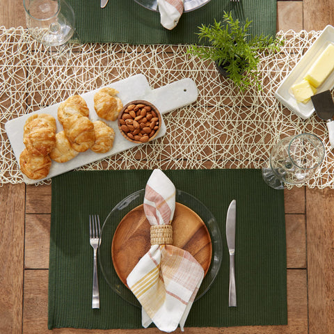 DII dining setup with dark green placemats adding subtle texture to tables