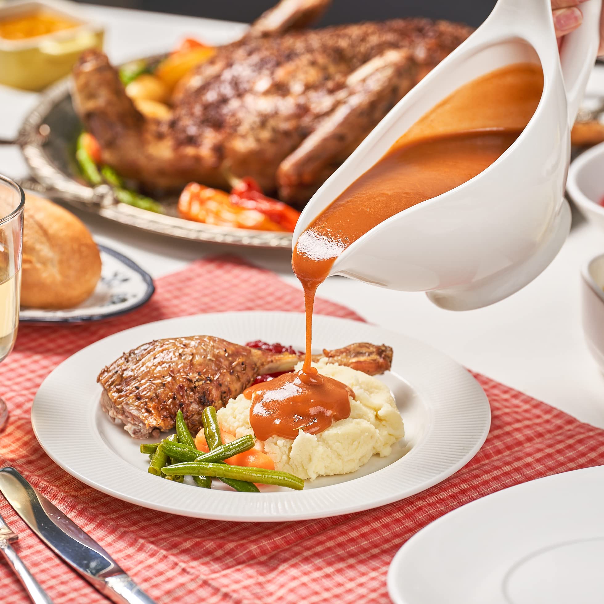 Dinnerlit Gravy Boat porcelain finish adds an elegant touch to tableware.