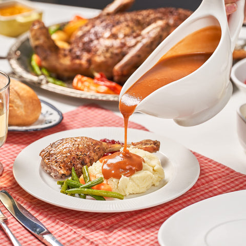 Dinnerlit Gravy Boat porcelain finish adds an elegant touch to tableware.