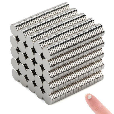DIYMAG Small Stronge magnets on a fridge holding photos securely displayed