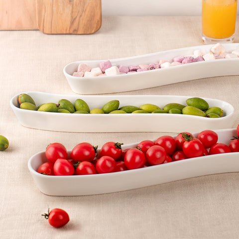 Dizada long-arc olive tray for stylish display during entertaining.