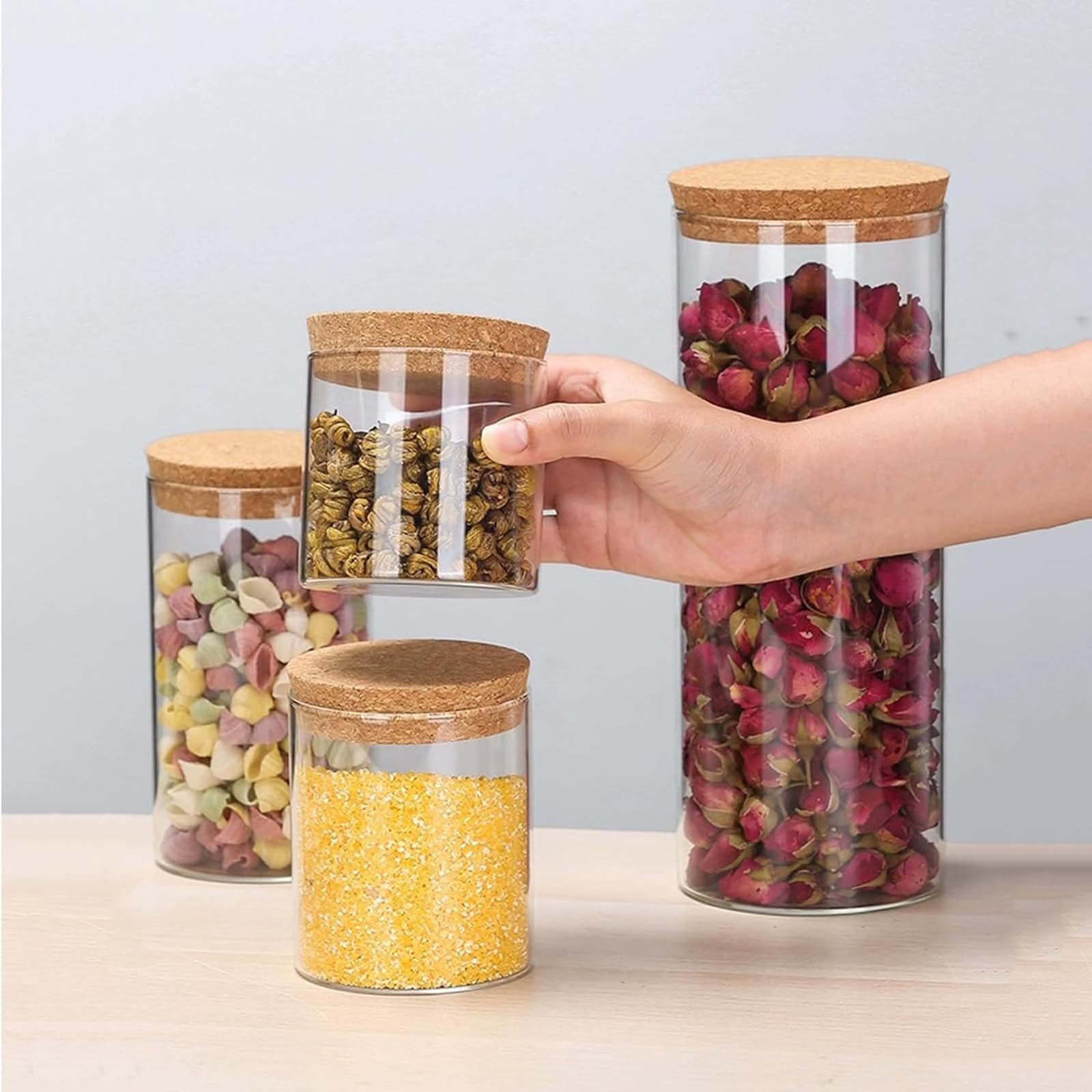 DNIENKGE elegant jars enhance kitchen cabinet organization and pantry clarity.