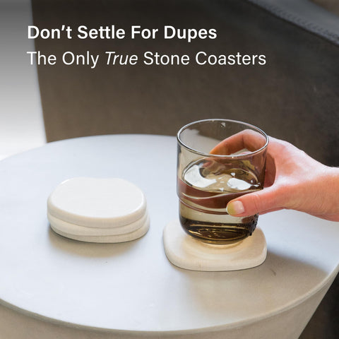 Dorai home decor scene with sandstone coasters on a table.