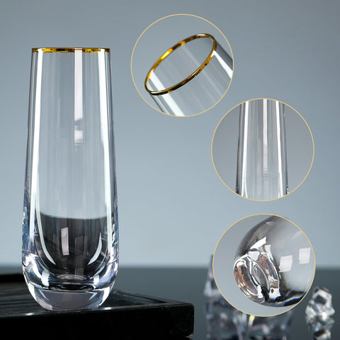 DORELINA champagne glass close-up shows gold rim detail.