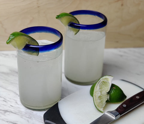 Close-up of cobalt rim on a Dos Sueños glass, highlighting artisanal craftsmanship.