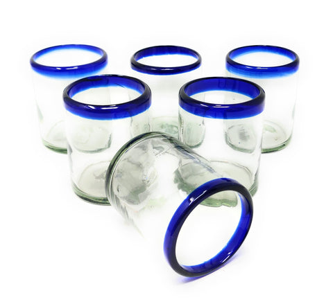 Dos Sueños hand-blown glass set with cobalt blue rims for elegant table setting.