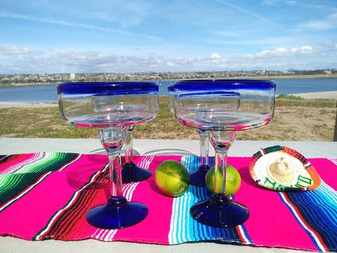 Dos Sueños margarita glass with cobalt blue rim, elegant for gatherings.