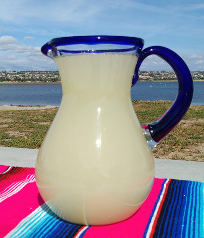 Dos Sueños pitcher with cobalt blue rim for bright presentation