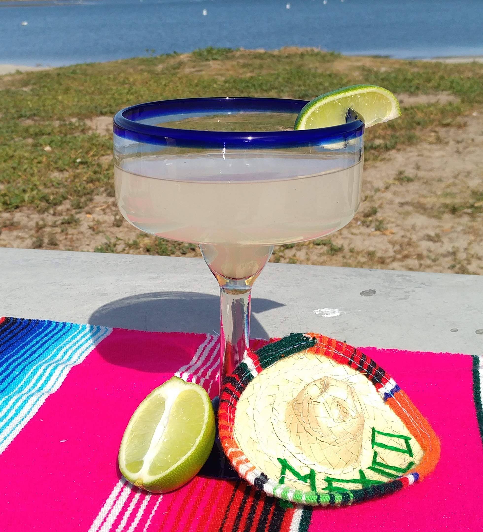 Unique artisan-made margarita glasses by Dos Sueños, each with character.