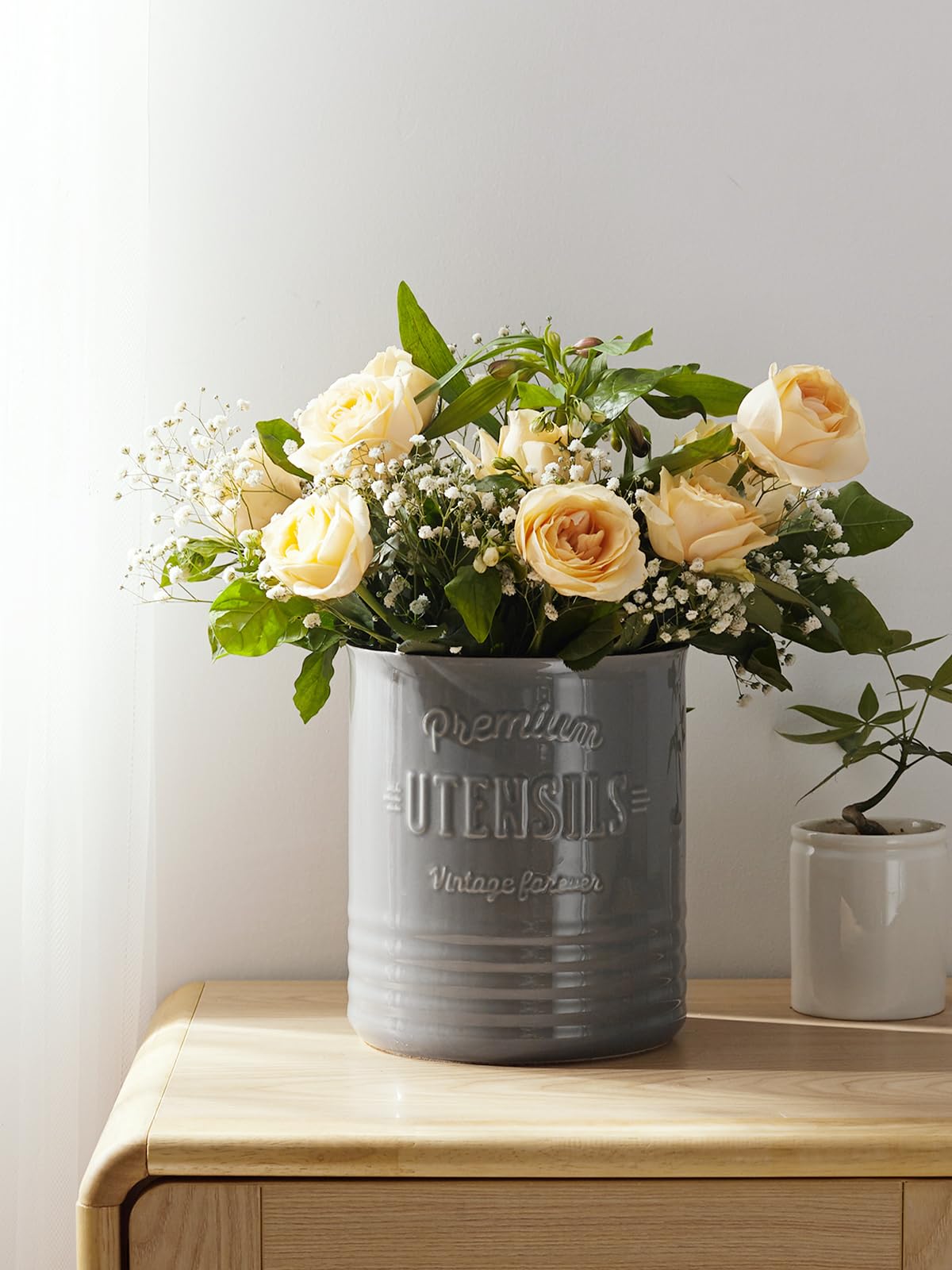DOWAN ceramic crock with stable base reduces tipping on busy countertops.