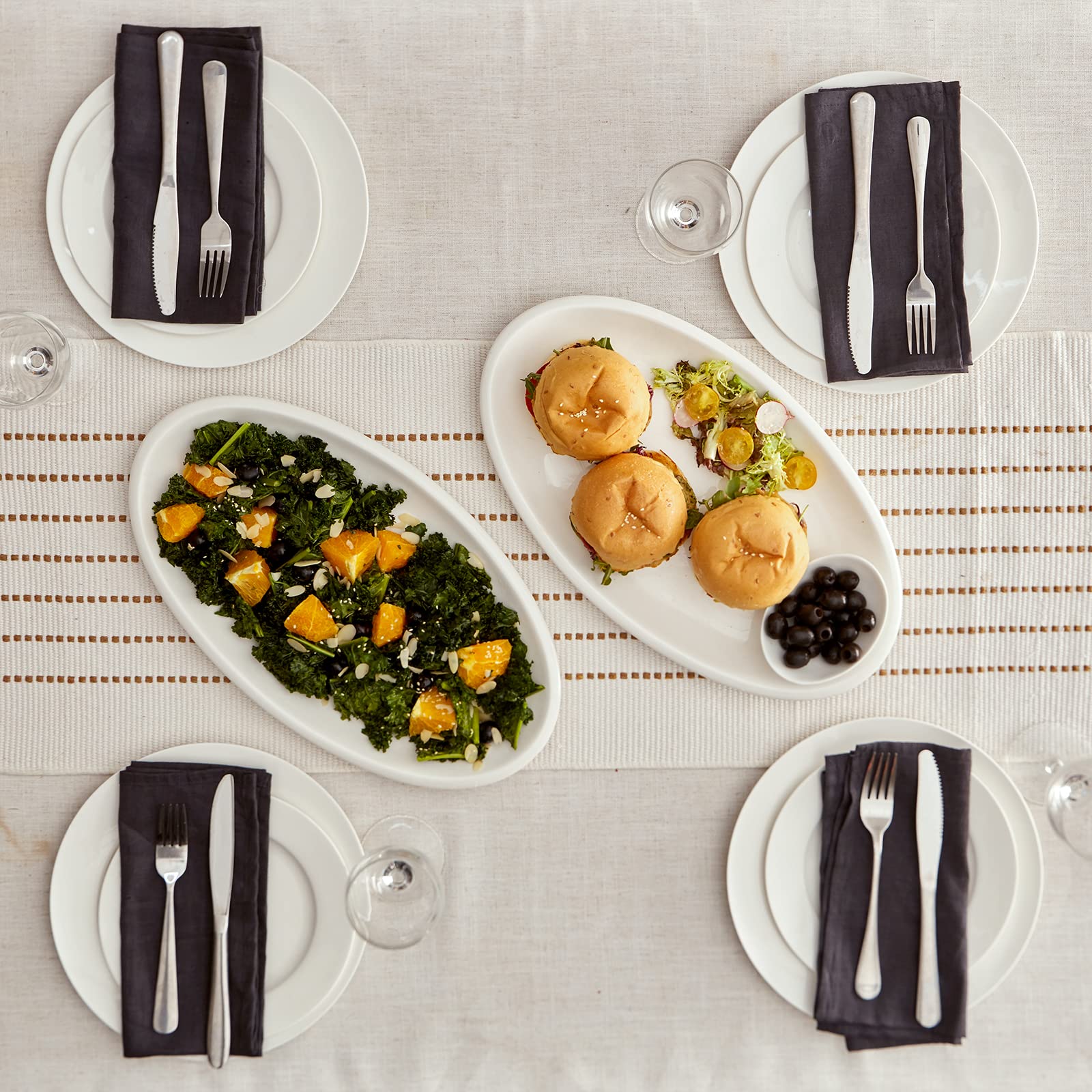 DOWAN high-gloss white serving platter adds modern table decor.