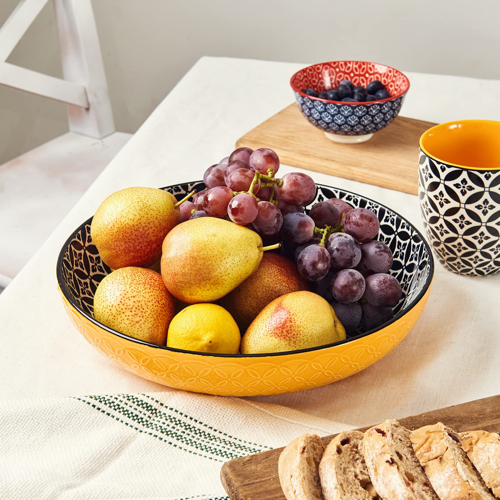 Dowan black serving bowl pairs with modern tables for pasta, fruit, or sides.