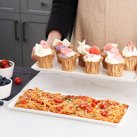 Dowan porcelain serving platters showcase appetizers and meals with style.