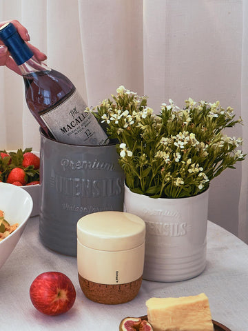 DOWAN porcelain utensil crock has a smooth finish that wipes clean.