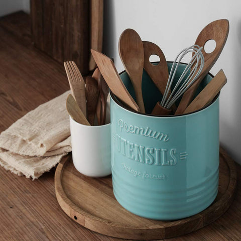 Cork mat base protects countertops from scratches beneath the utensil crock.
