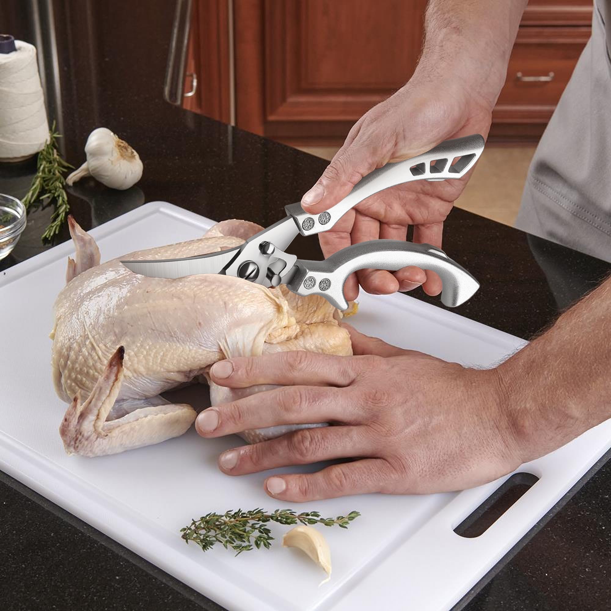 Dream Reach poultry shears with ergonomic seahorse-arc handle for comfortable ambidextrous use.