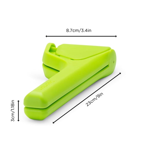 Dreamfarm Lime Fluicer demonstrates two-handed pivot for ergonomic juicing.