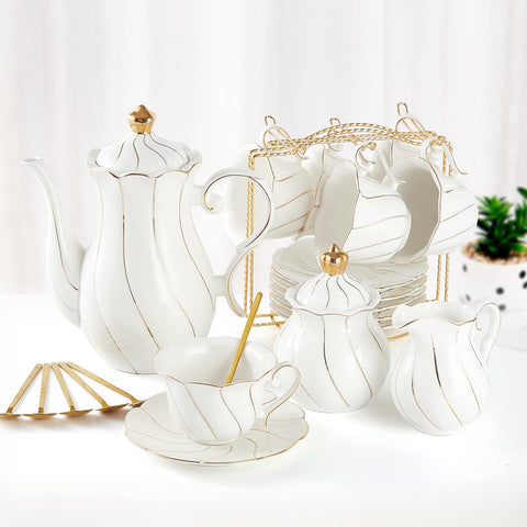 DUJUST white porcelain tea set on a stand, elegant presentation for guests.