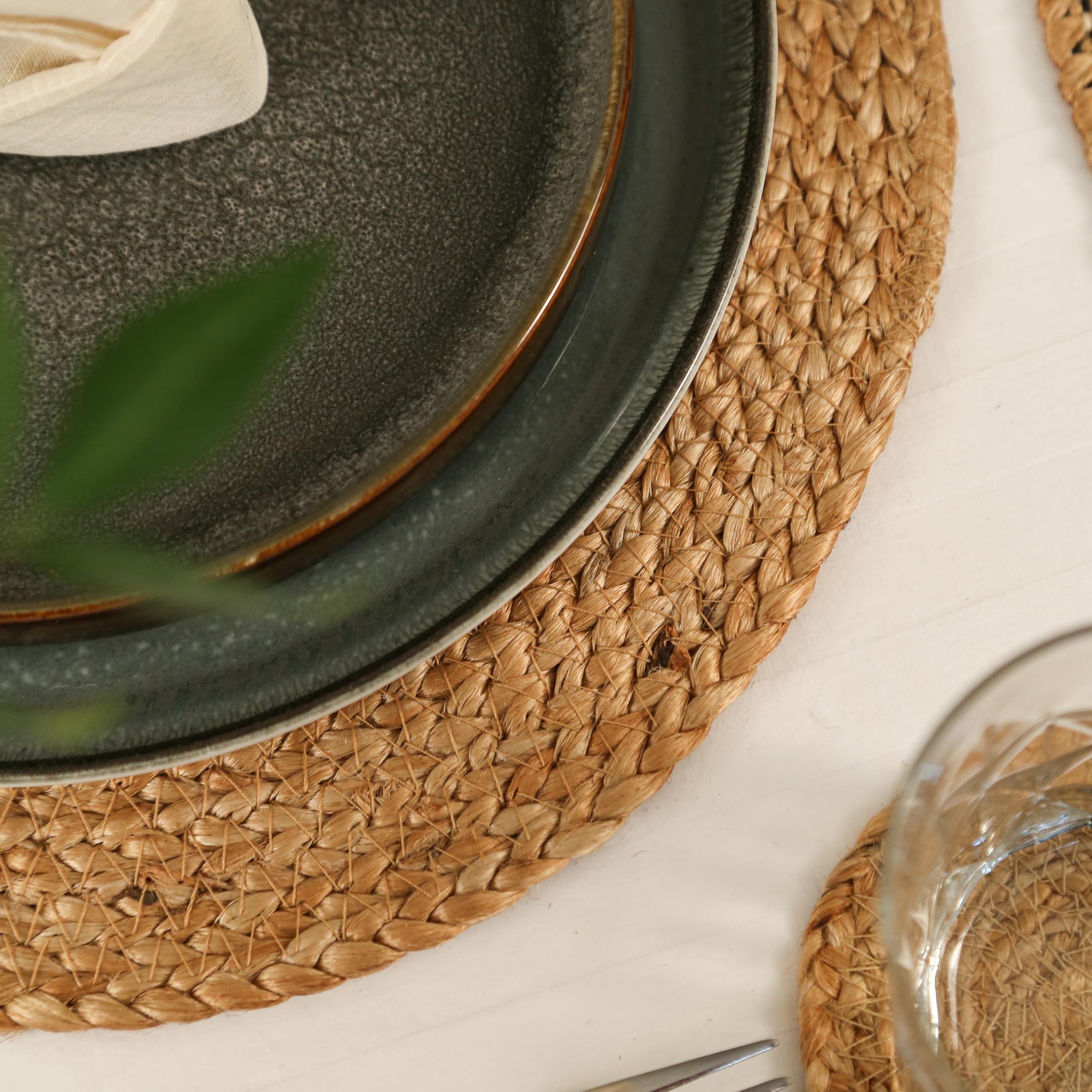 Eco Crave Jute Placemats in natural tones enhance indoor and outdoor dining settings.